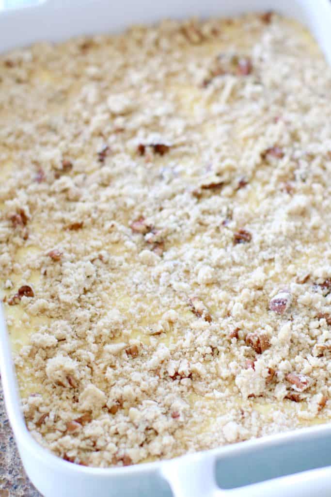 pecan crumb topping sprinkled on prepared lemon and pineapple cake mix
