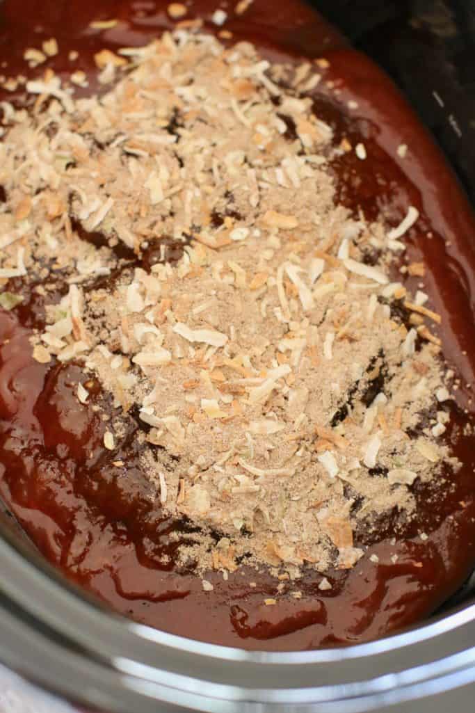 barbecue sauce, apricot preserves and onion soup mix in the bottom of a 5-quart oval crock pot