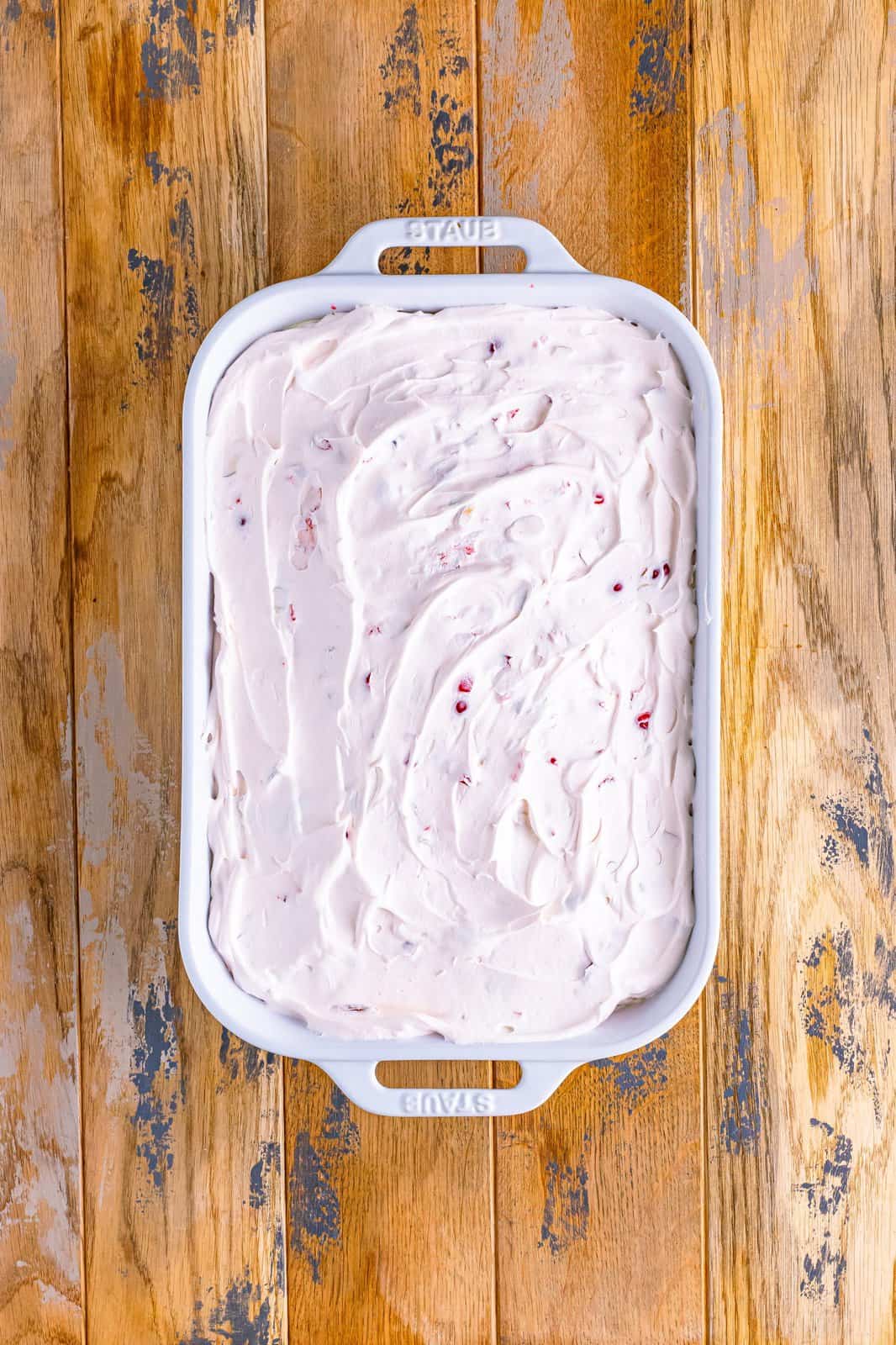 cherry whipped topping spread evenly on top of cake. 