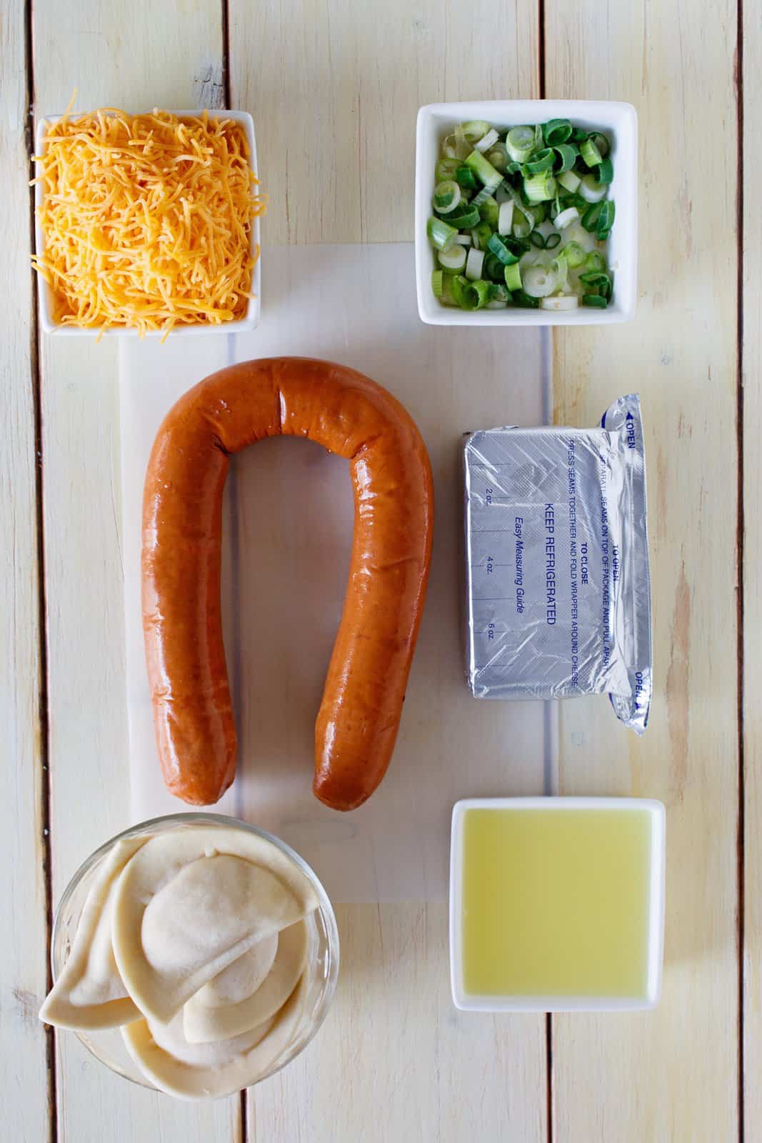kielbasa, cheese, green onion, frozen pierogi, cream cheese and chicken broth.