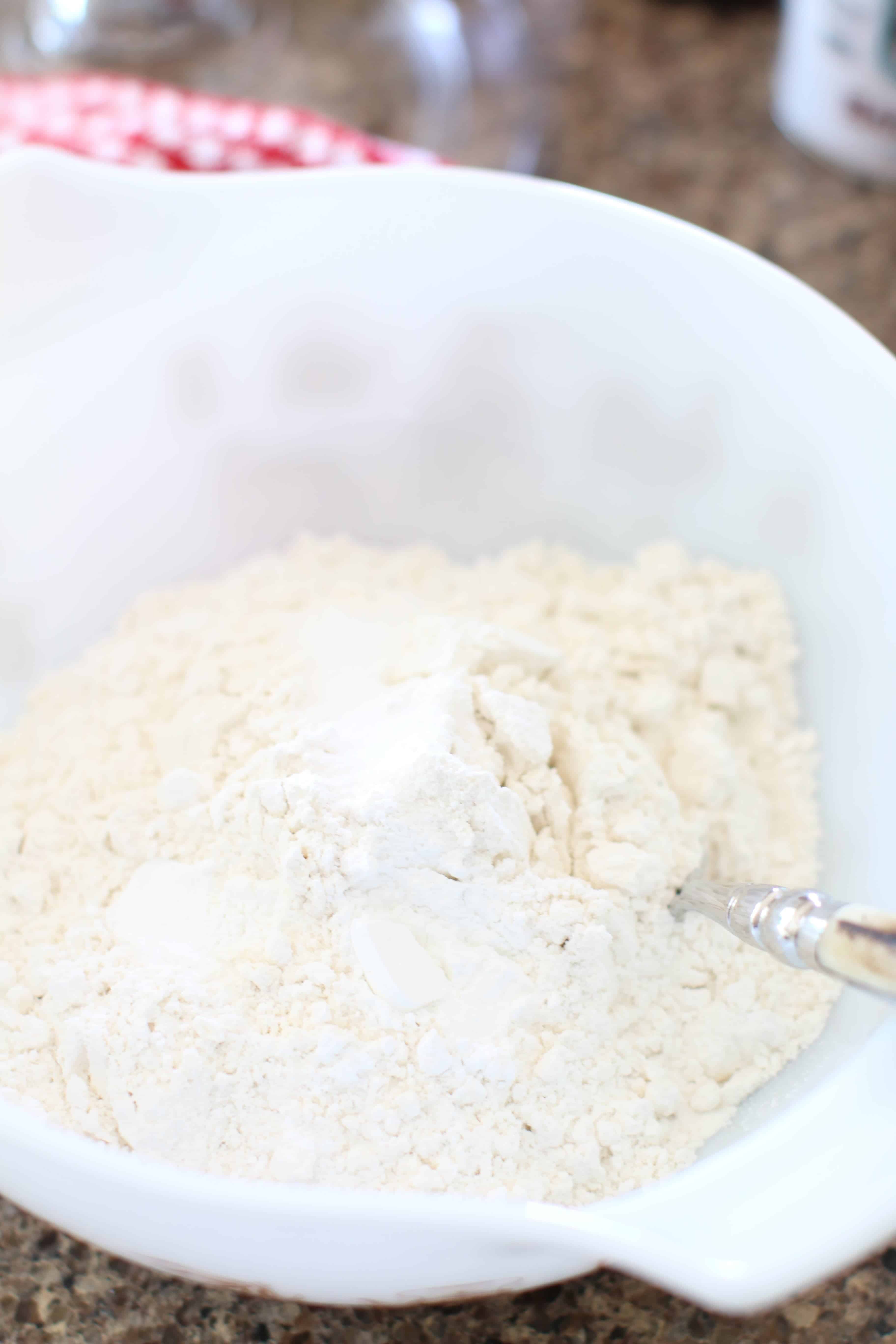 all purpose flour, baking powder and salt mixed together with a fork in a bowl.