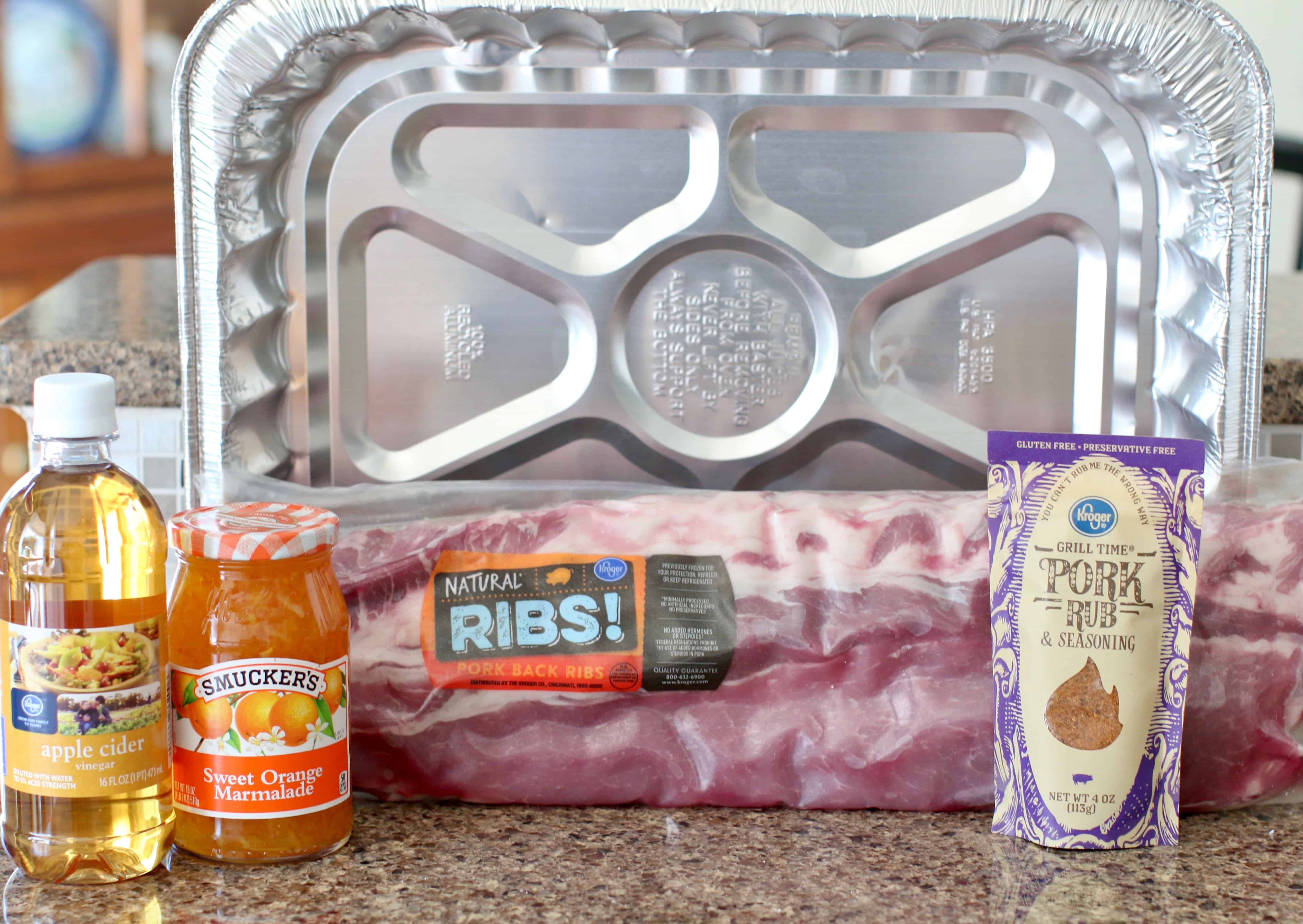 ingredients needed to make grilled ribs: pork rub, rack pork ribs, orange marmalade, apple cider vinegar.