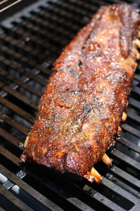Grilled ribs finished cooking on a gas grill.