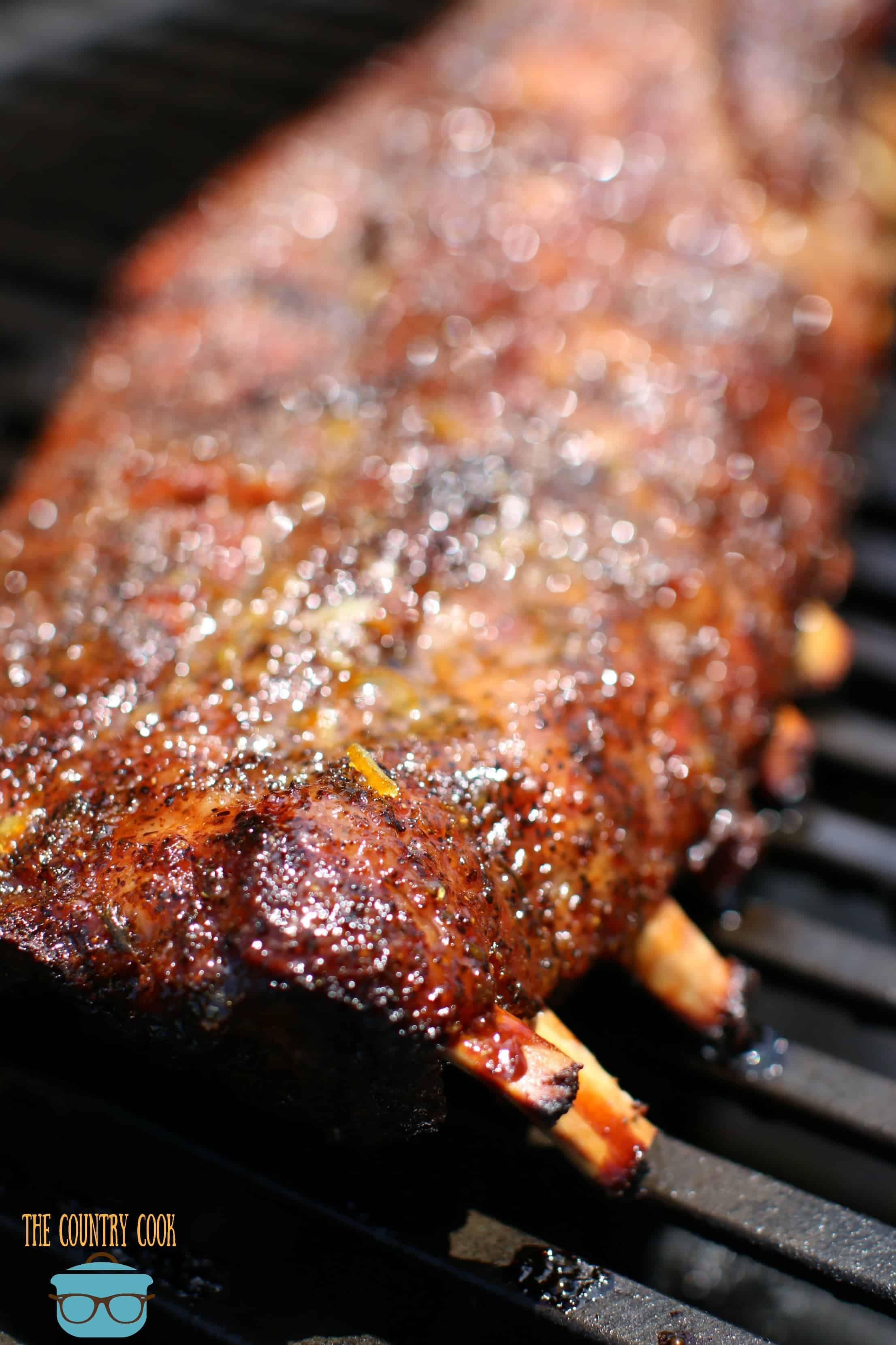 Pork ribs on the gas grill covered with glaze