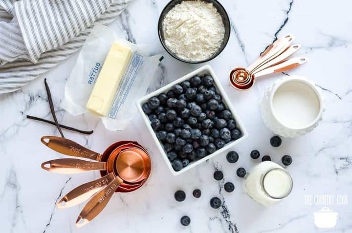 blueberry cobbler ingredients: self-rising flour, sugar, milk, salted butter, vanilla extract, fresh blueberries.