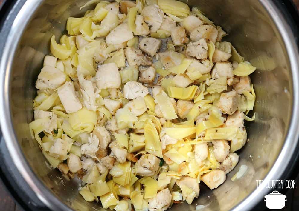 chopped artichoke hearts stirred together with diced chicken breasts.