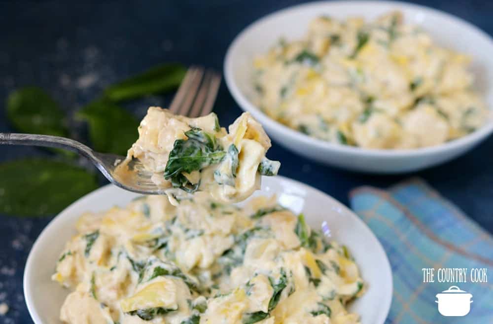 low carb creamy artichoke chicken made in the instant pot and served in bowls.