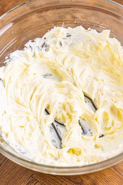 cream cheese beaten with an electric mixer until smooth in a bowl.