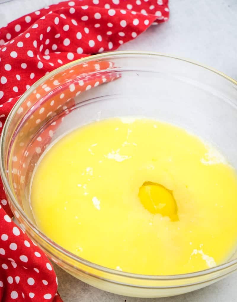 melted butter, buttermilk, egg, orange juice, orange zest in a large bowl