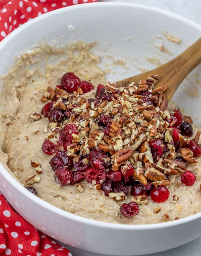 sliced cranberries and chopped pecans added to cranberry bread batter