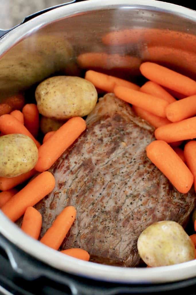 baby carrots, Little Potatoes and beef rump roast added to electric pressure cooker insert