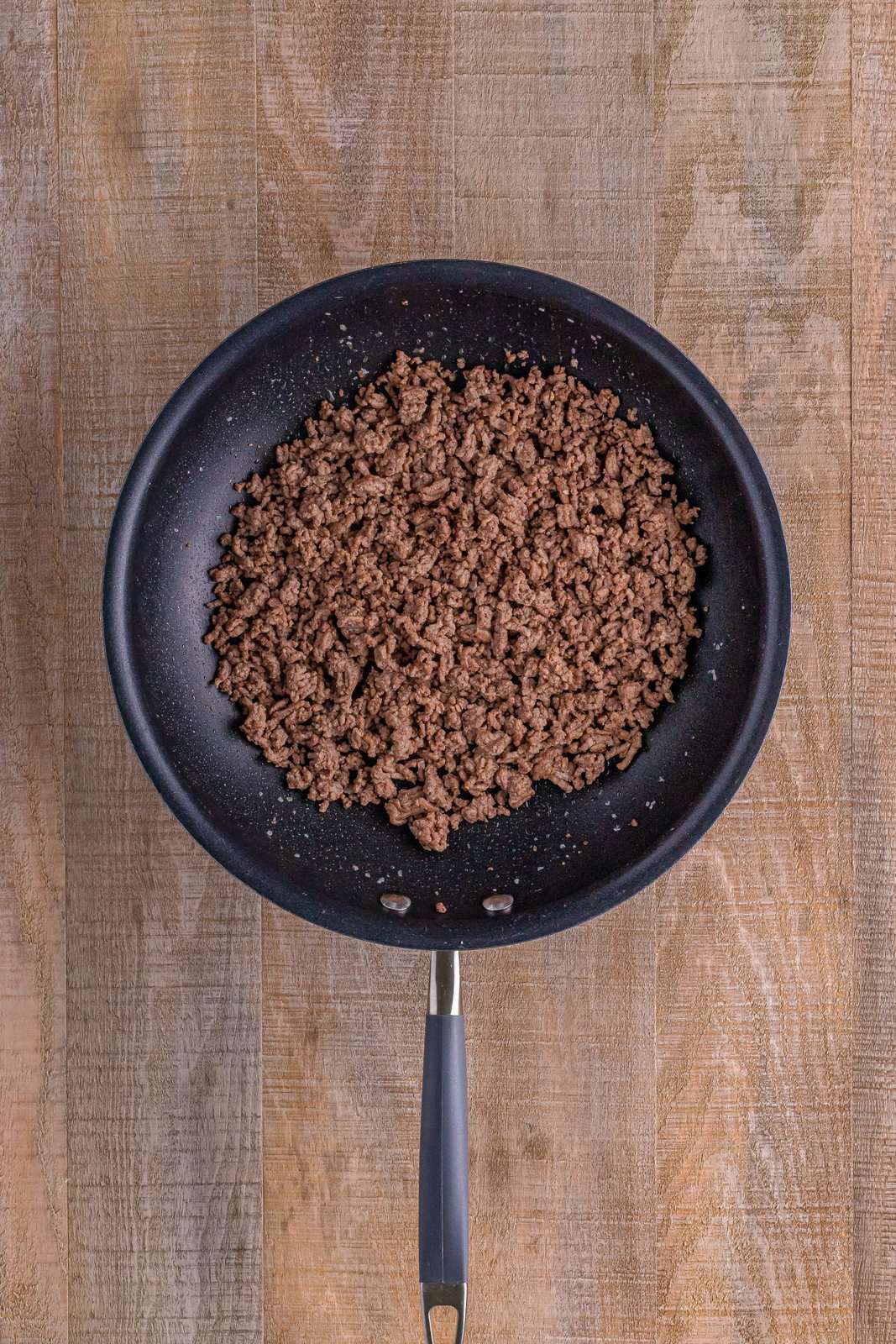 cooked ground beef shown in a skillet. 