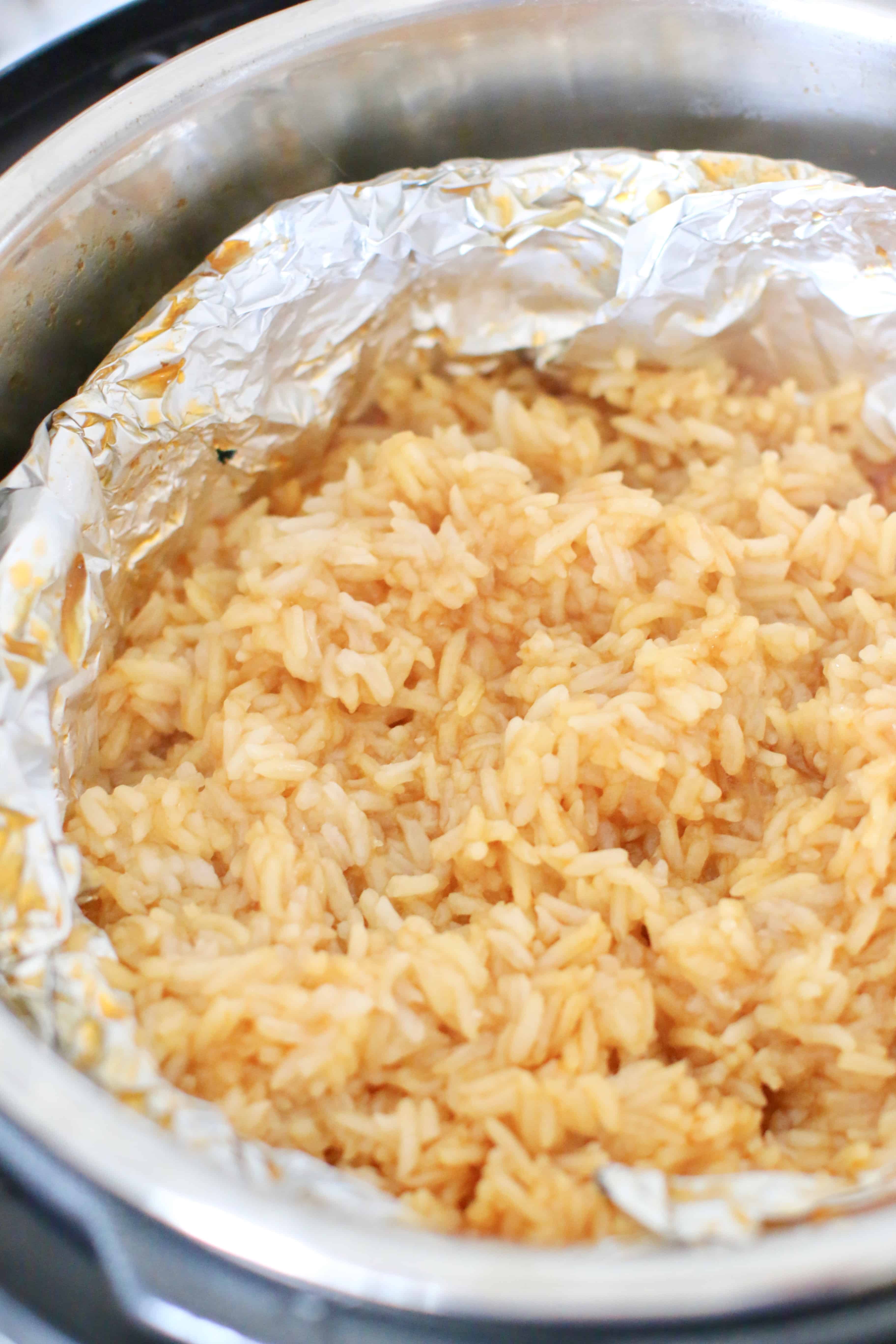 cooked, Instant Pot long grain rice shown in a baking pan.