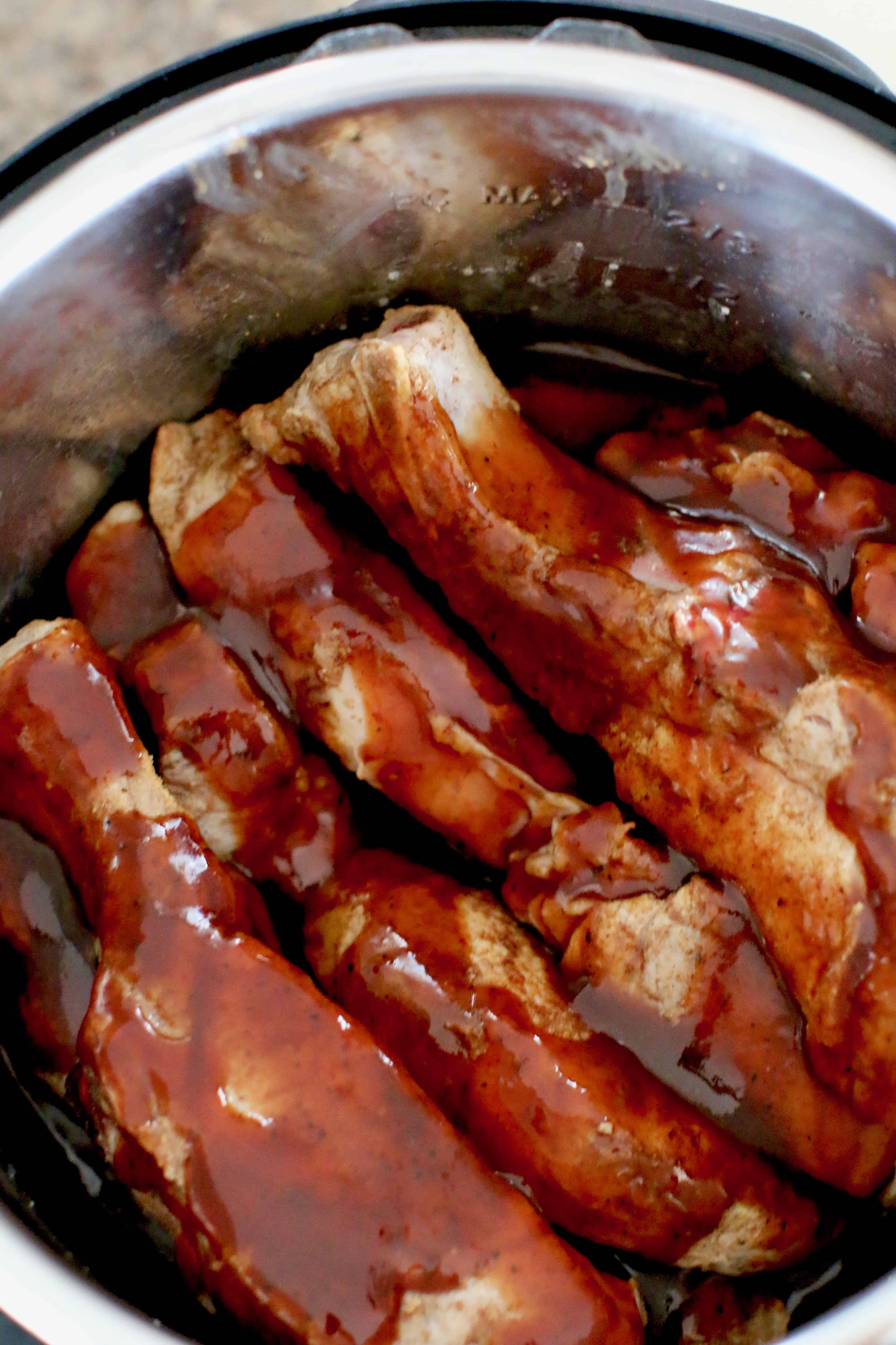 bbq sauce covered ribs in an instant pot.