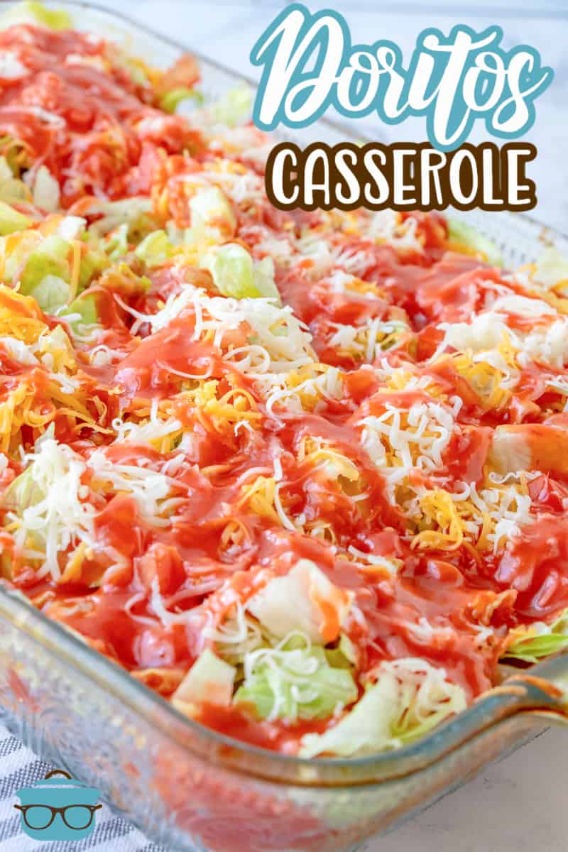 Doritos Casserole recipe from The Country Cook, fully assembled casserole shown in a glass baking dish.