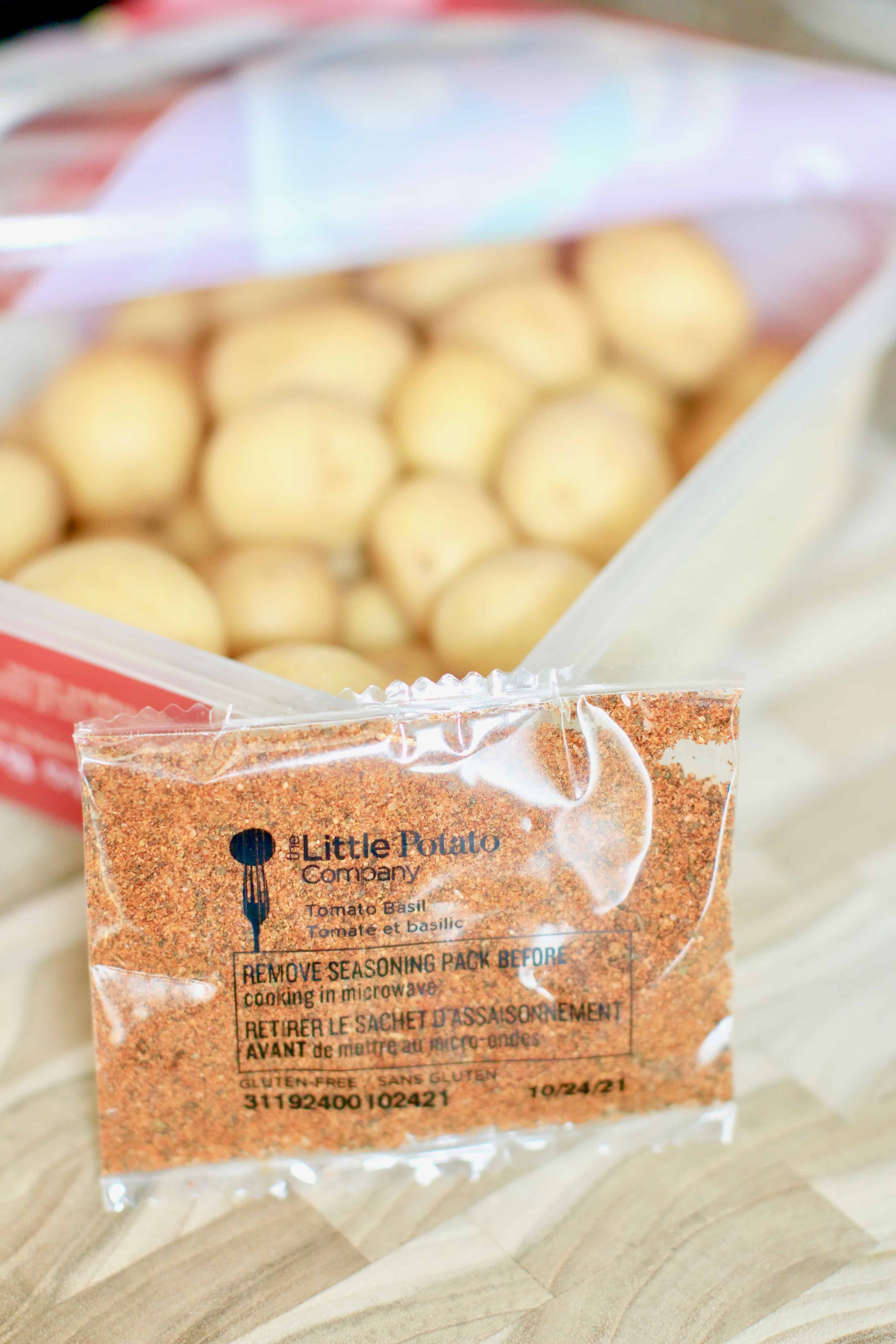 Microwaveable Tomato Basil Little Potatoes with seasoning packet removed from the container. 