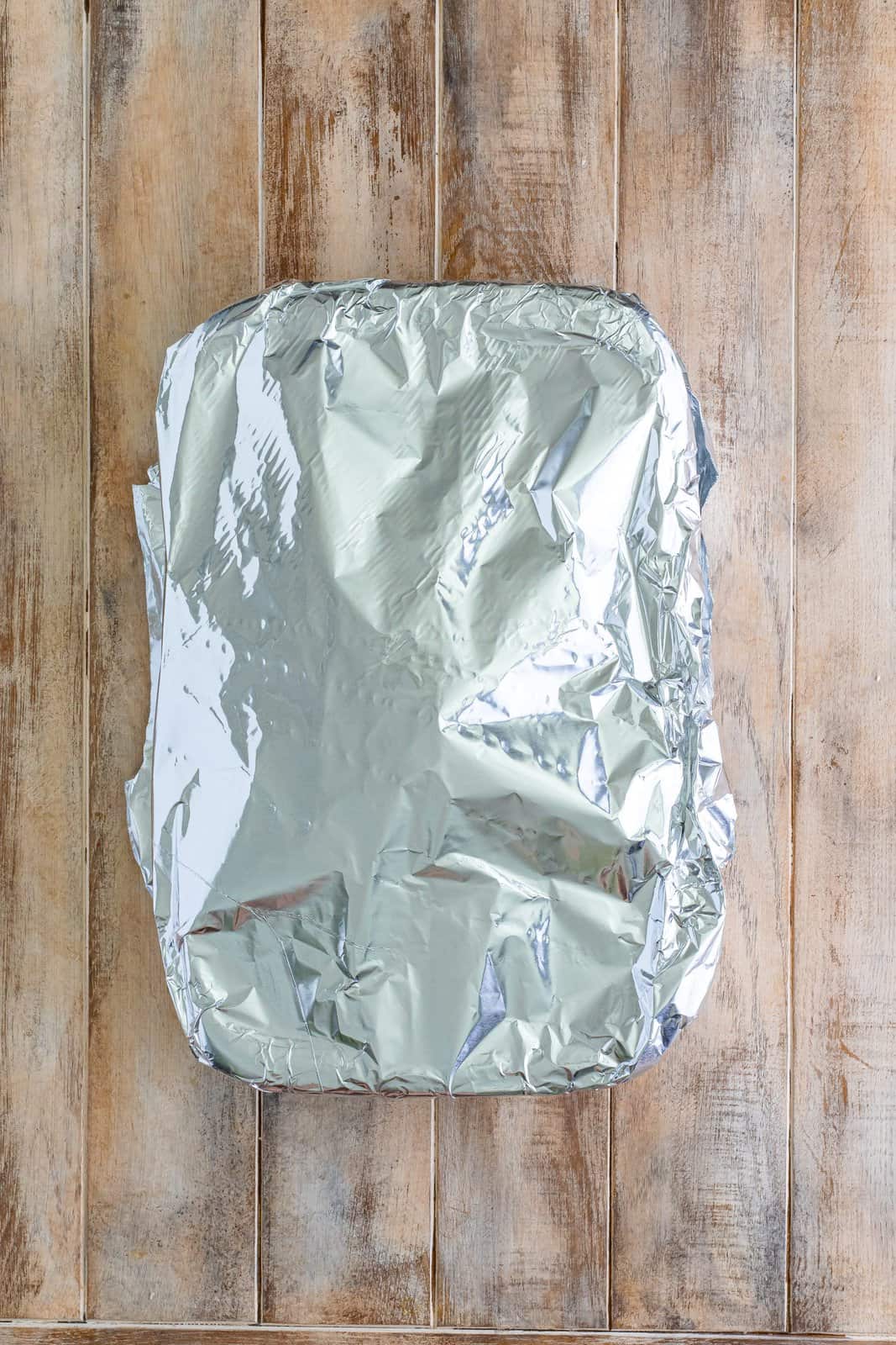 an aluminum foil covered baking dish. 