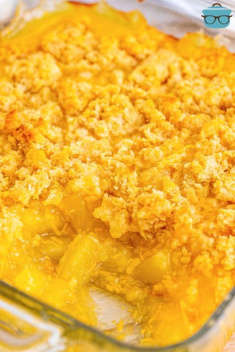 side angle photo of a baked dish of pineapple casserole.
