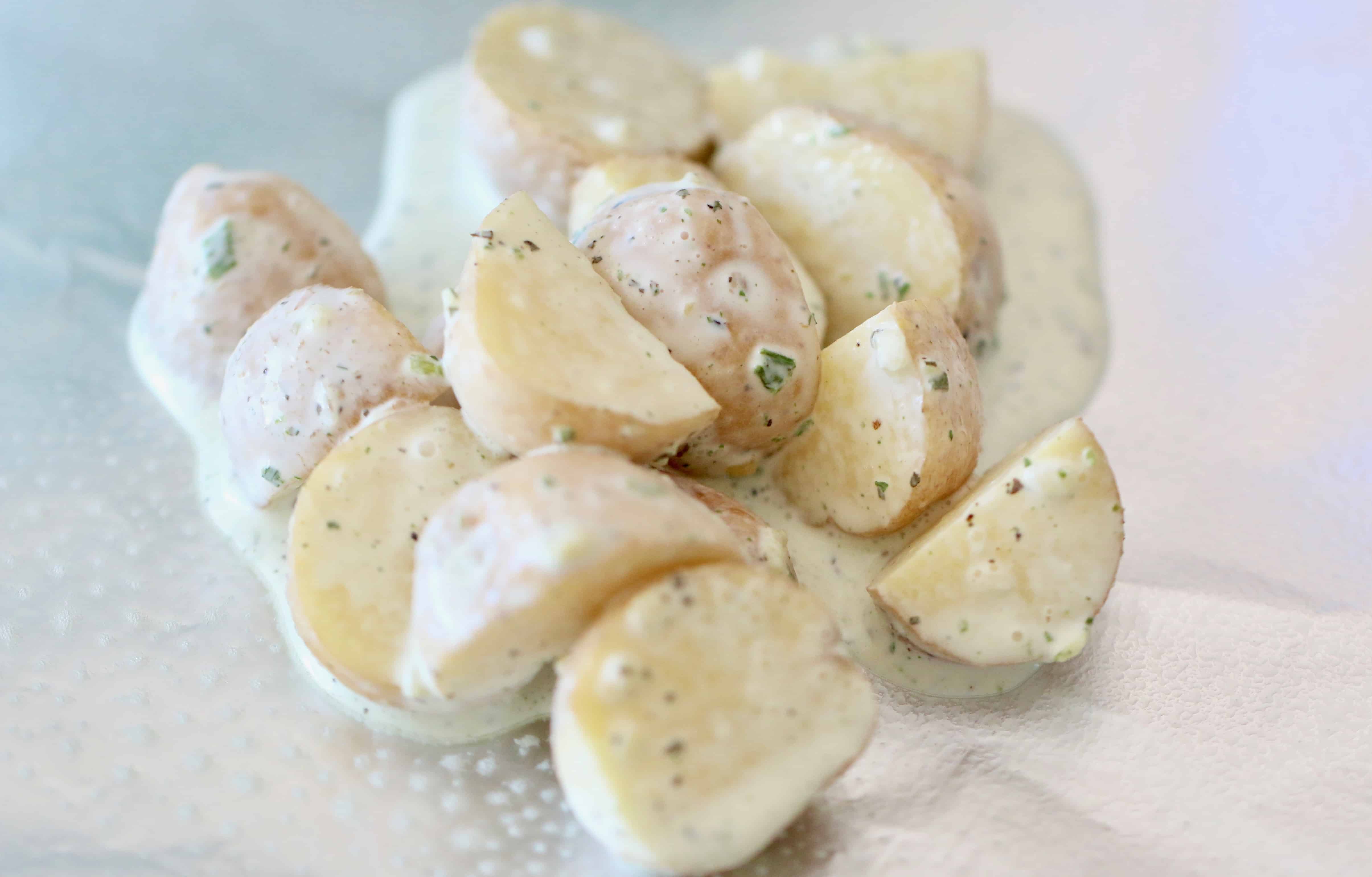 heavy cream coated Little Potatoes on a large foil sheet.