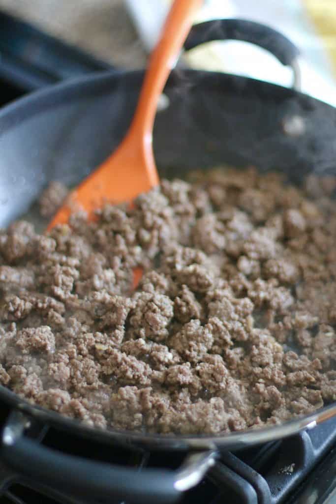 browning and crumbling ground beef in a large skillet