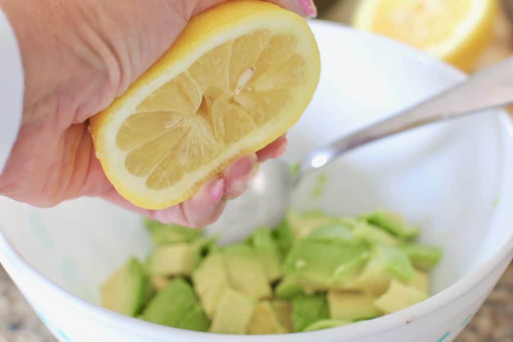 lemon juice squeezed onto diced avocado