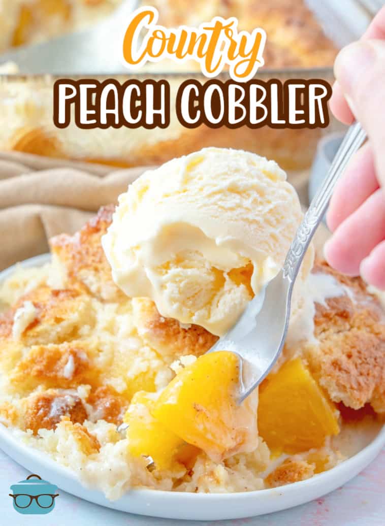 Country Peach Cobbler shown on a round white plate with a hand holding a fork inserting into the peach cobbler. 