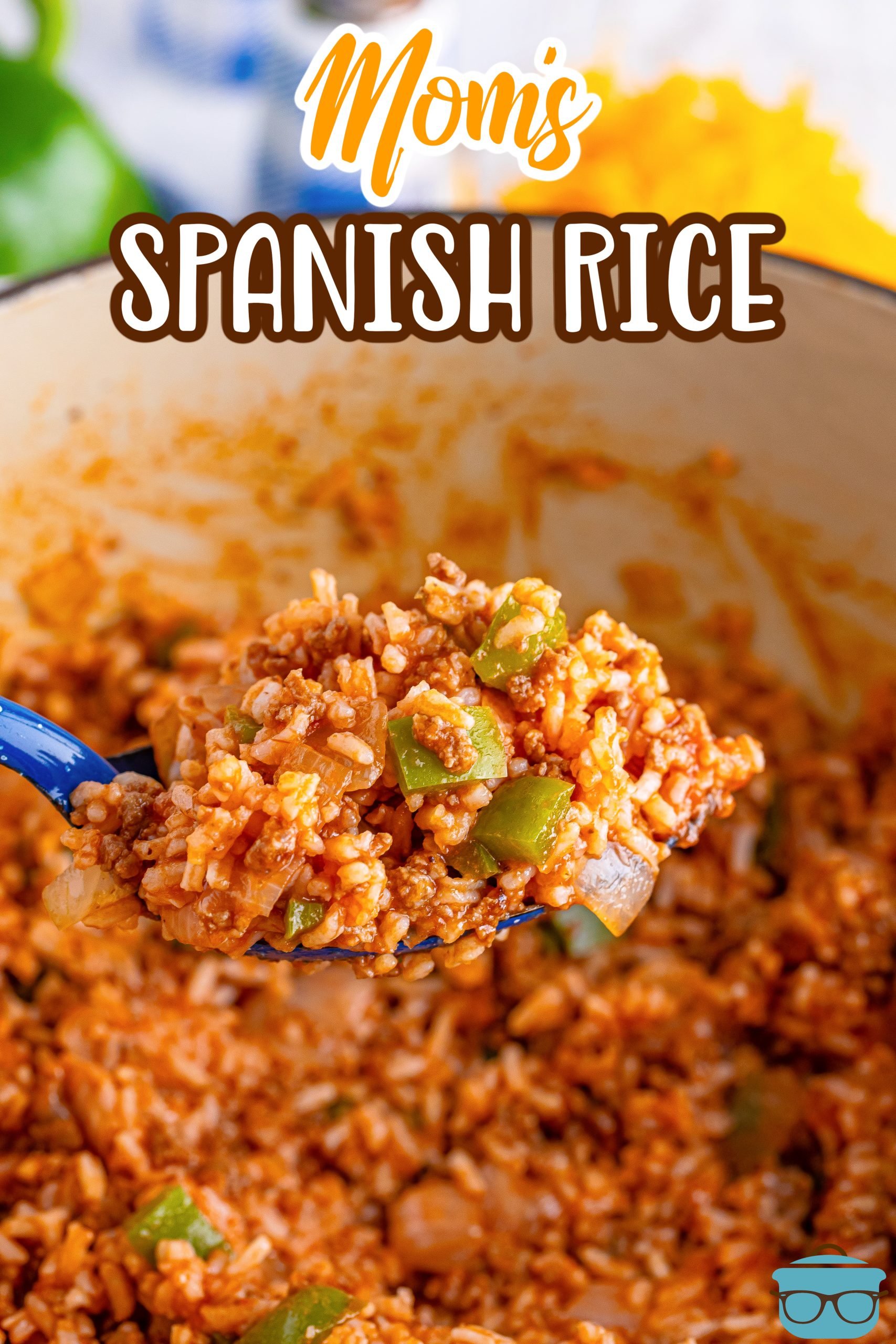 A blue serving spoon holding a scoop of Spanish Rice over a pot.