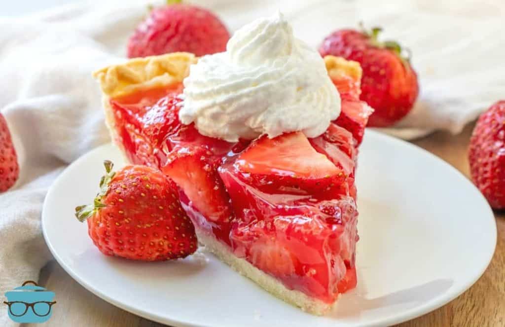 slice, Shoney's Strawberry Jell-o Pie on a white plate topped with whipped cream