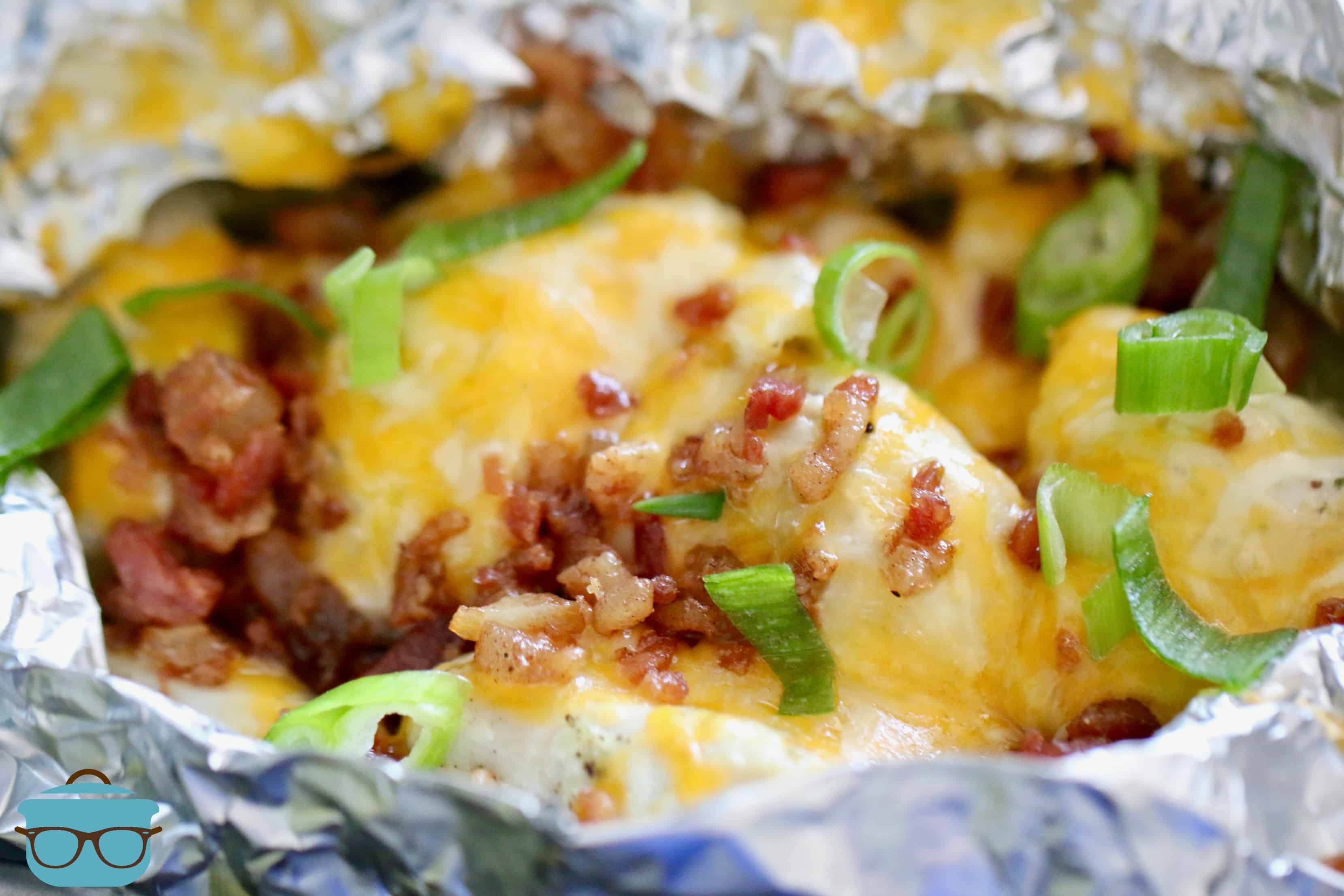 close up photo of opened Chicken Potato Foil Packets with bacon.