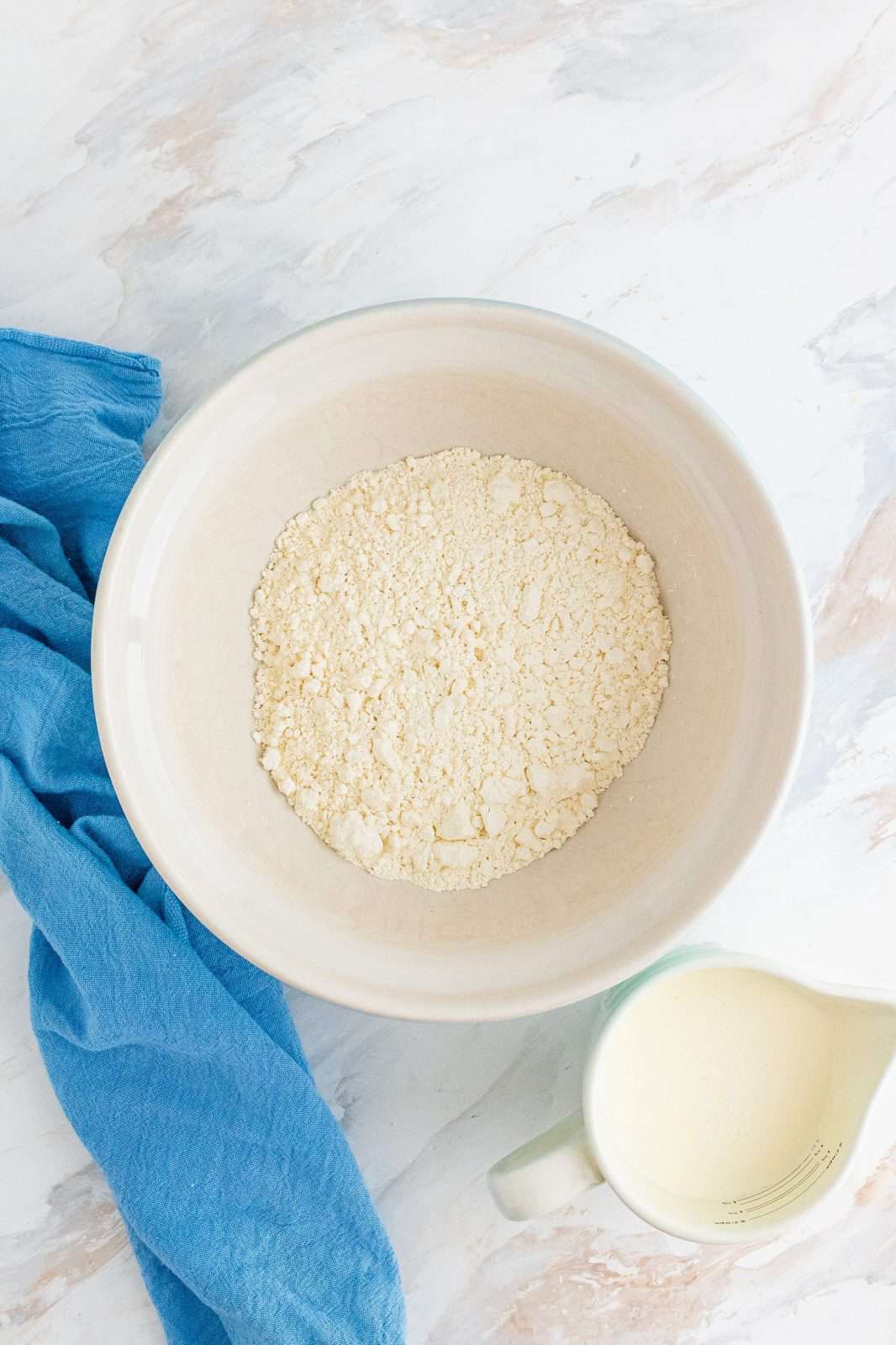 self-rising flour in a white bowl.