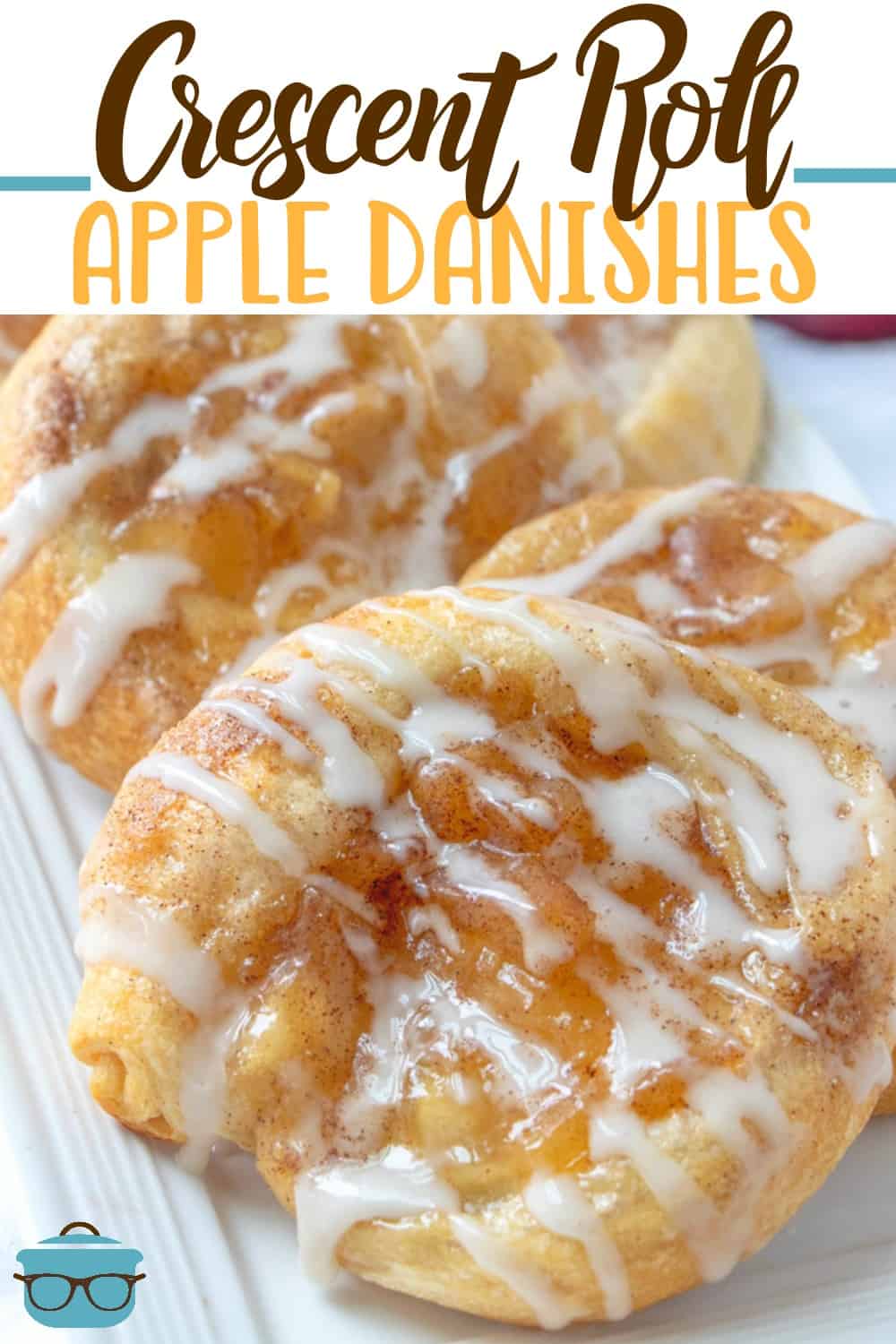Easy Crescent Roll Apple Danish recipe from The Country Cook. Apple danishes shown closeup and layered on a white platter. 