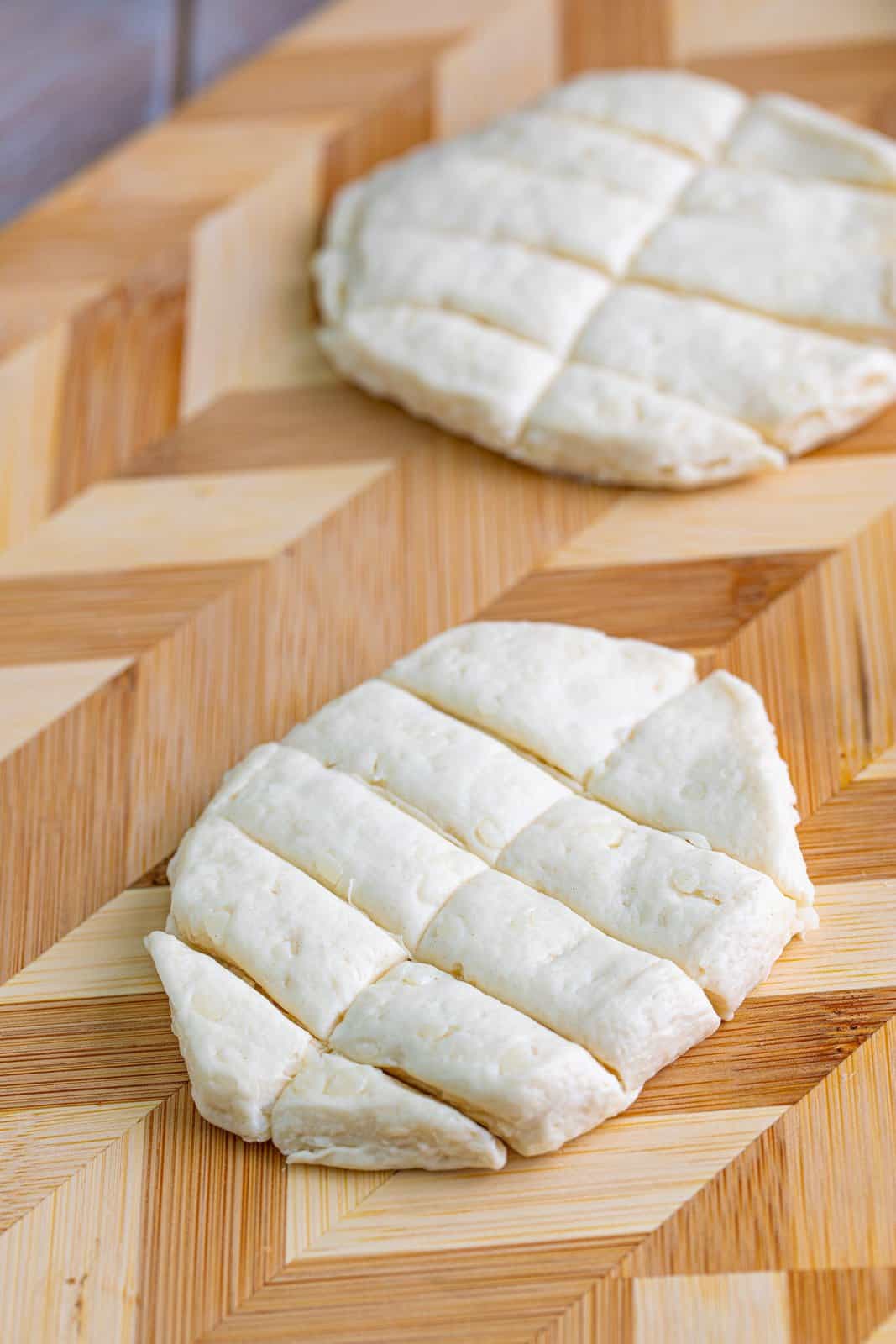flattened biscuits that have been cut into 10 strips.