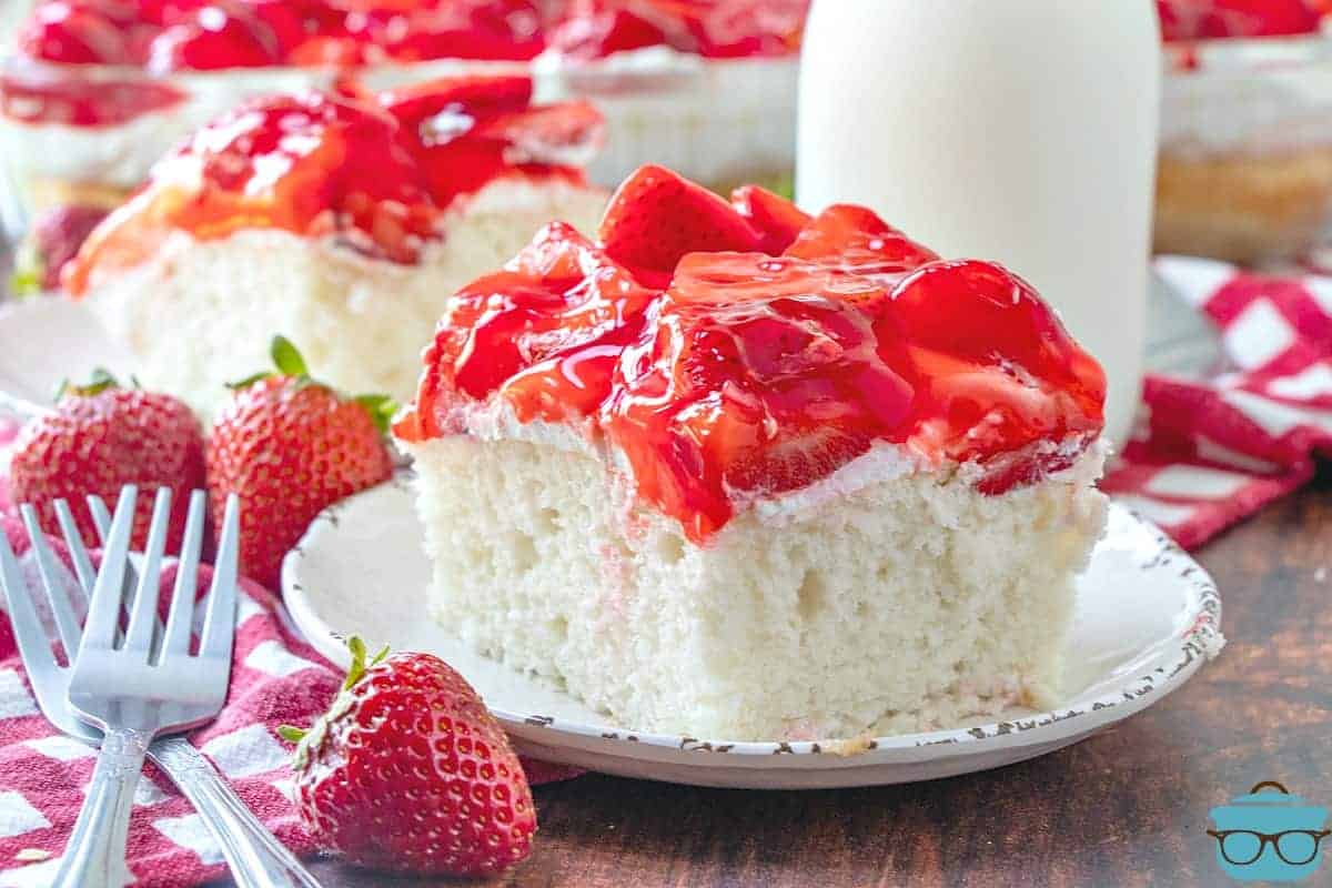 Strawberry Shortcake Cake, slice, served on a small white plate.