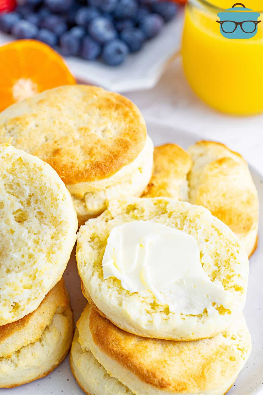 butter spread on the inside of a cream biscuits.