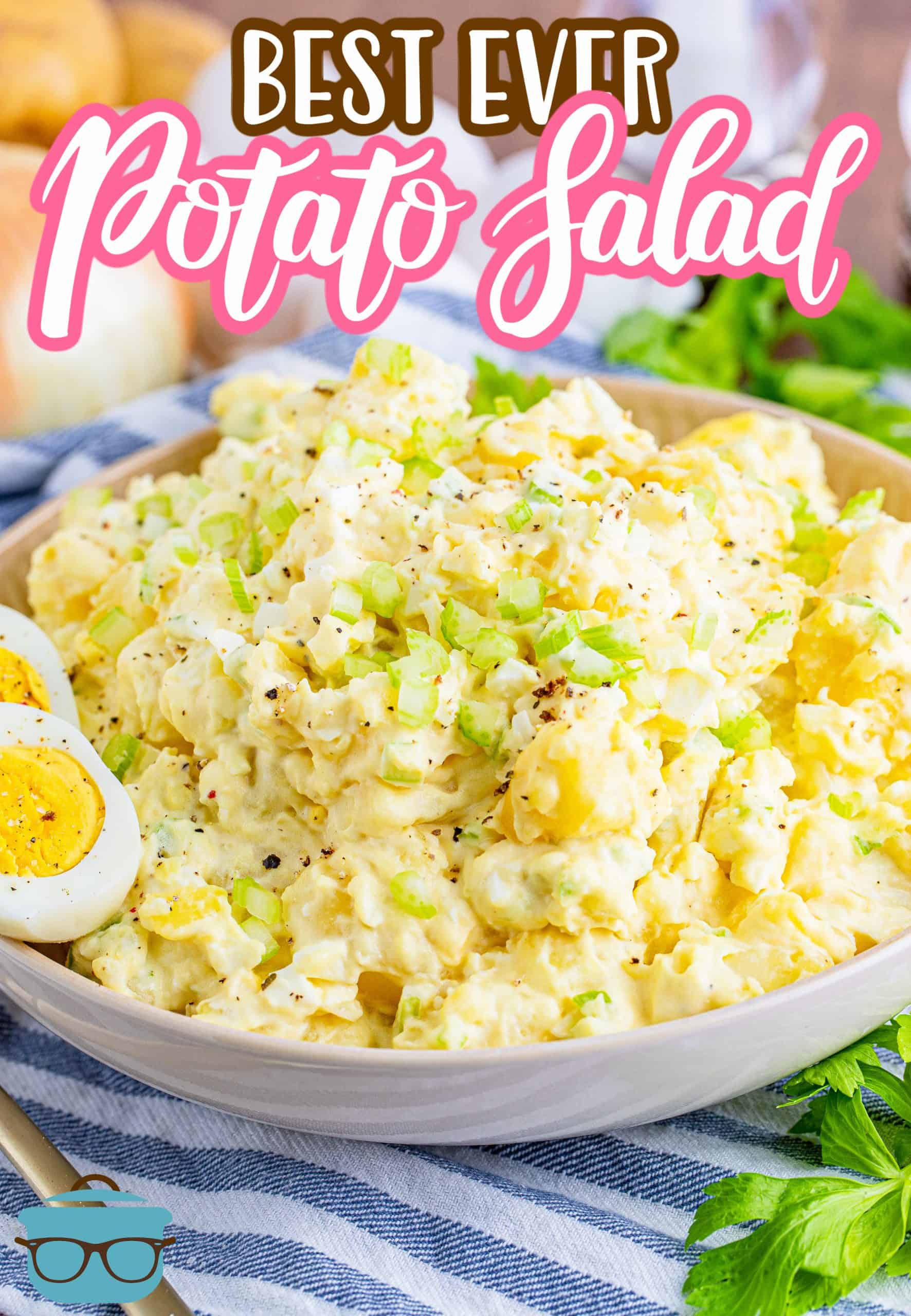 The Best Ever Potato Salad recipe from The Country Cook, potato salad shown in a large shallow bowl with a slice hard boiled egg on the side of the bowl.