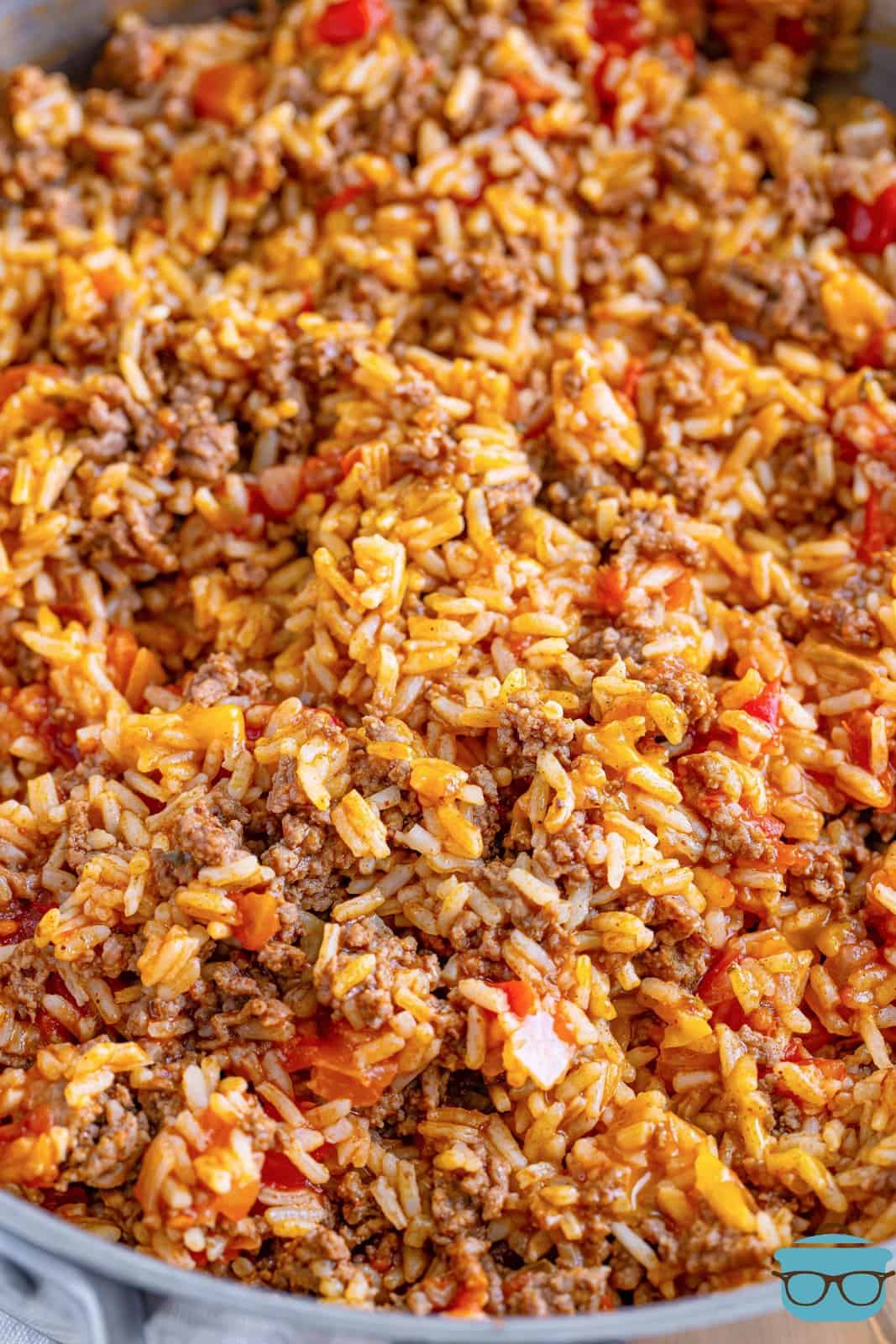 closeup photo of fully cooked Taco Rice in the skillet. 
