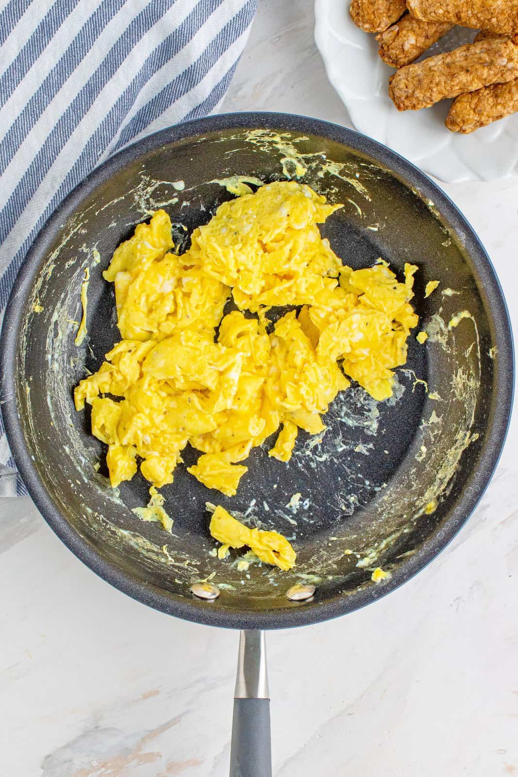 scrambled eggs shown in a skillet. 