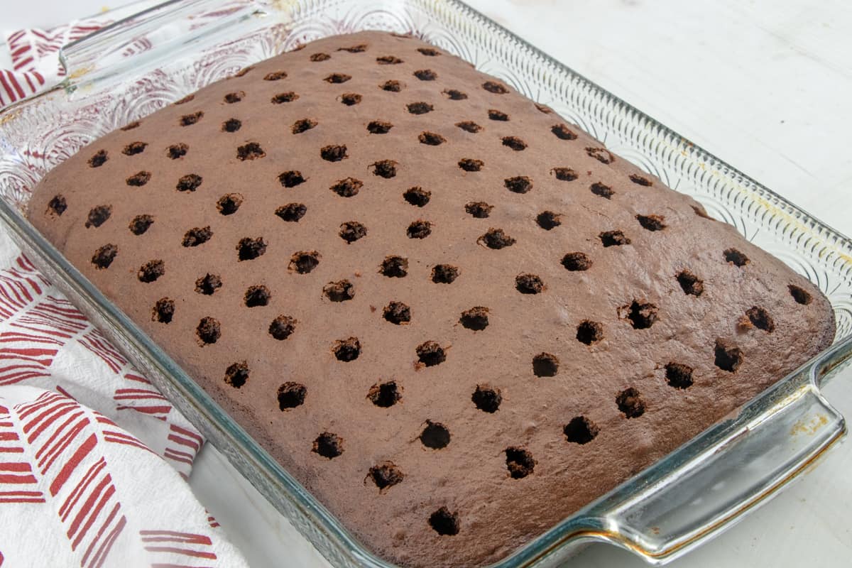 poked holes in a chocolate cake.