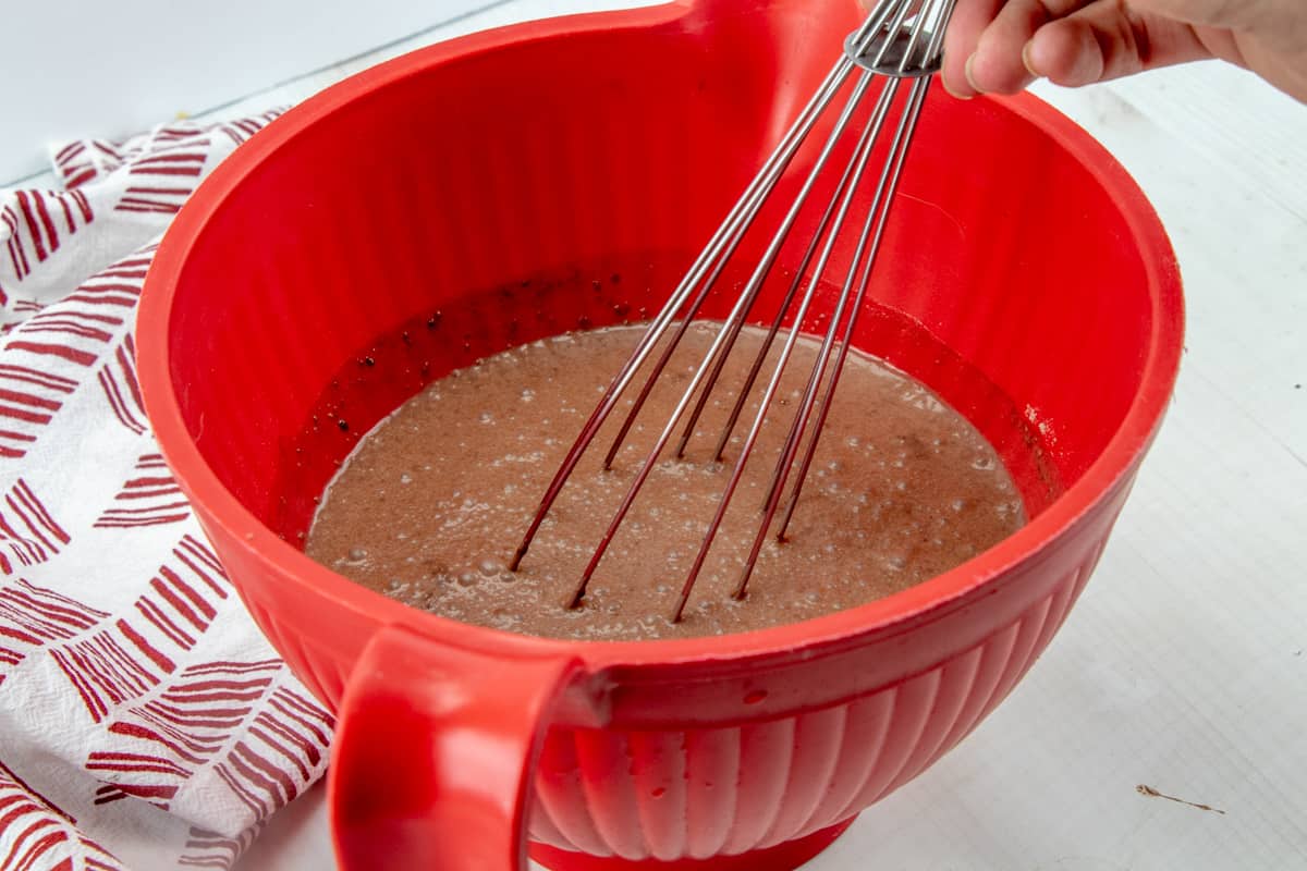 instant chocolate pudding whisked together in a red bowl.