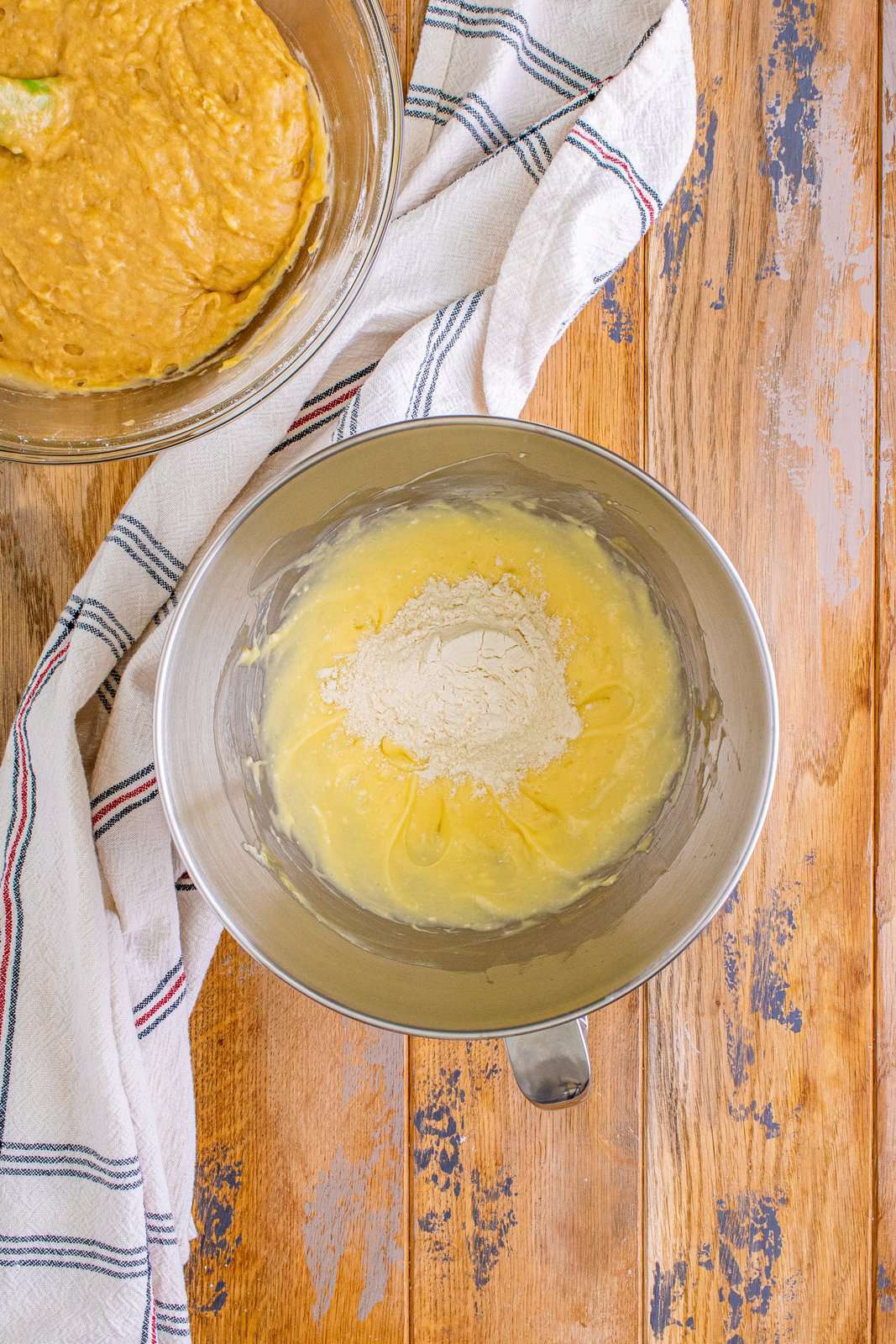 flour added to cheesecake batter in mixing bowl