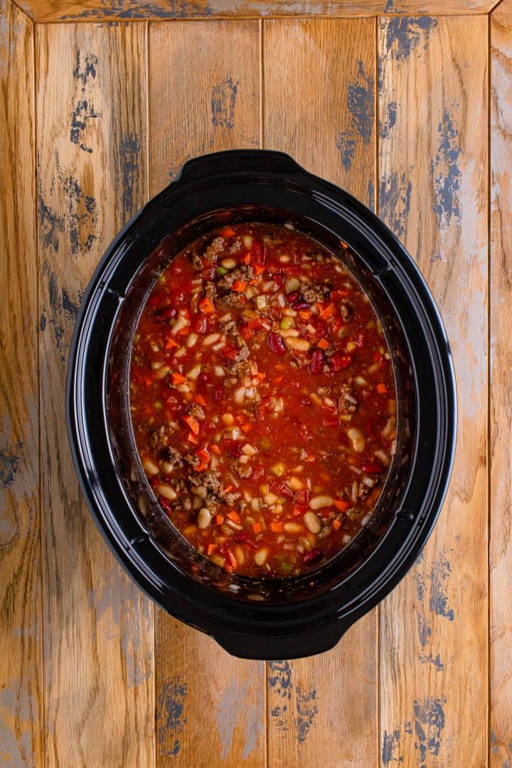 pasta e fagioli soup in an oval slow cooker.