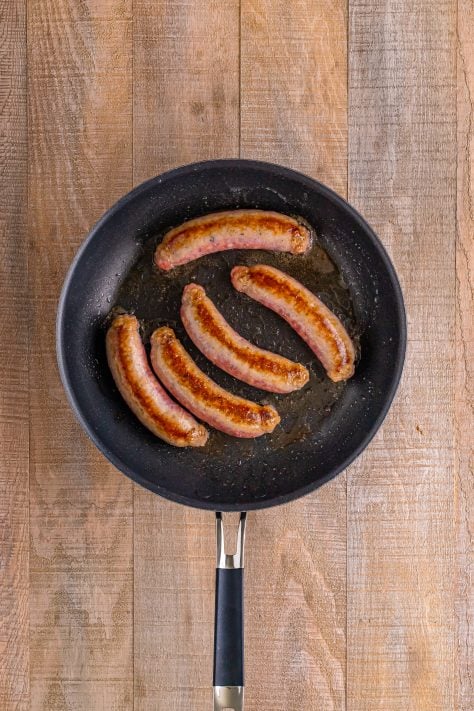 Cooked sausage in a pan.