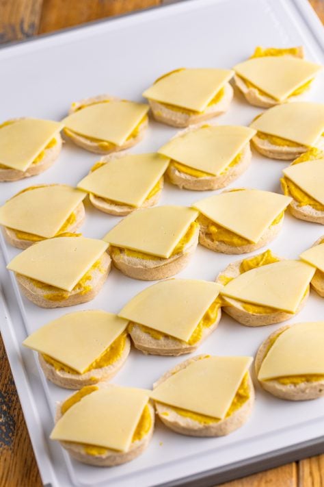 Swiss cheese on honey mustard covered biscuit dough.