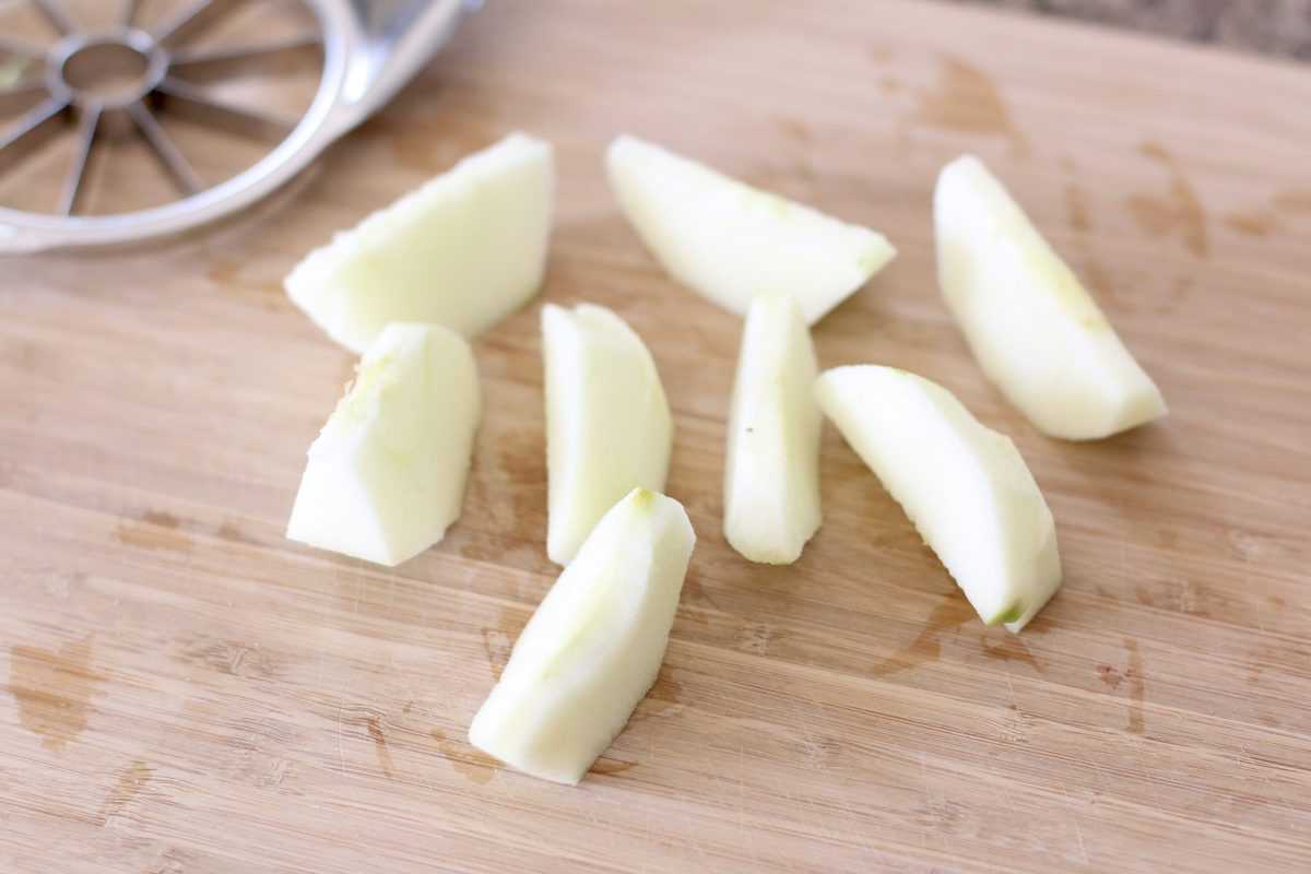 apple slices on a wooden cutting board
