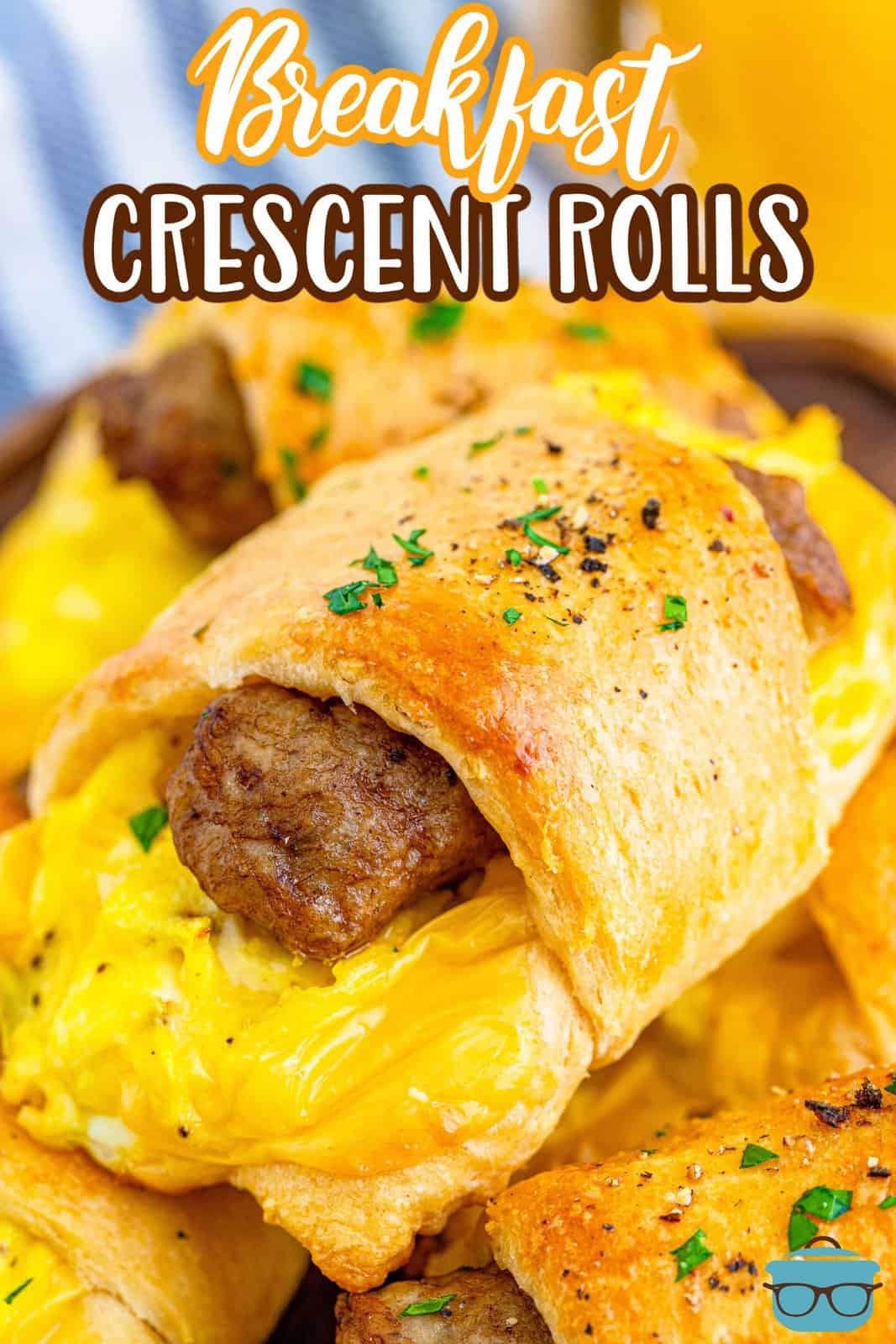 closeup photo of sausage, egg and cheese breakfast crescent rolls stacked on each other. 