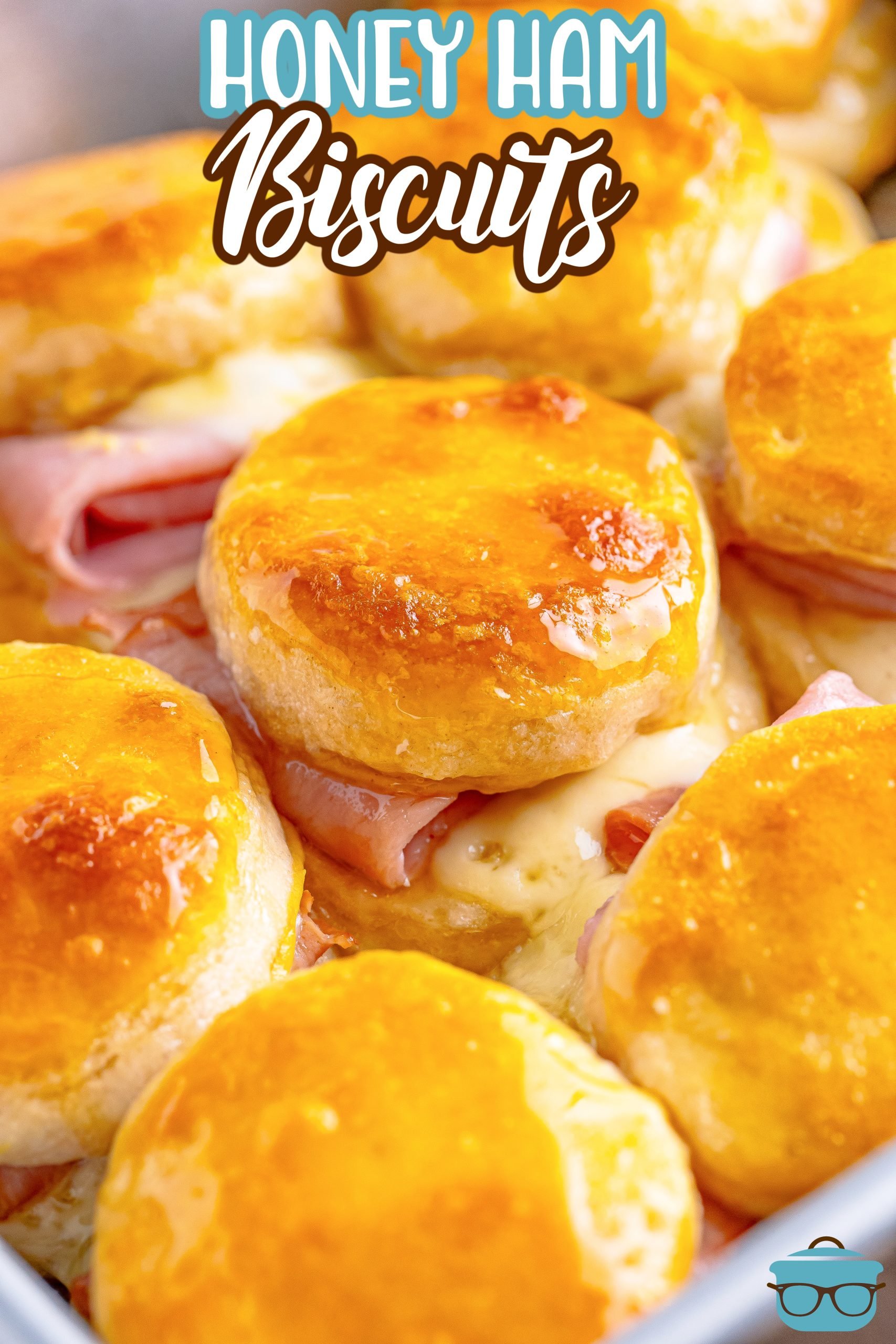 A bunch of Honey Ham Biscuits on a platter or baking tray.