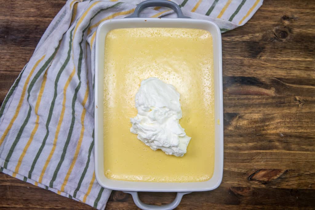 fresh whipped cream on top of fully cooled lemon bars 