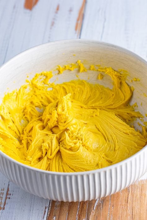 Yellow cake mix batter in a bowl.