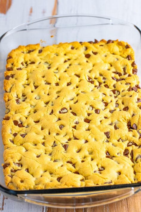 A baking dish with uncut Chocolate Chip Cookie Bars.
