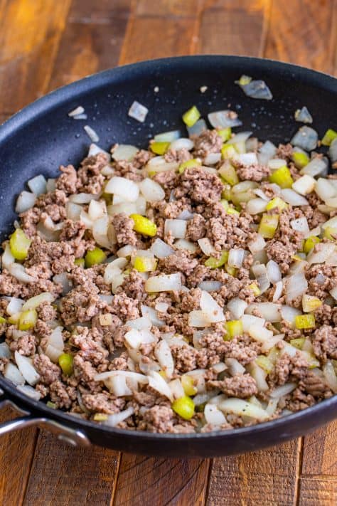 browning ground beef along with onions and celery in a skillet.